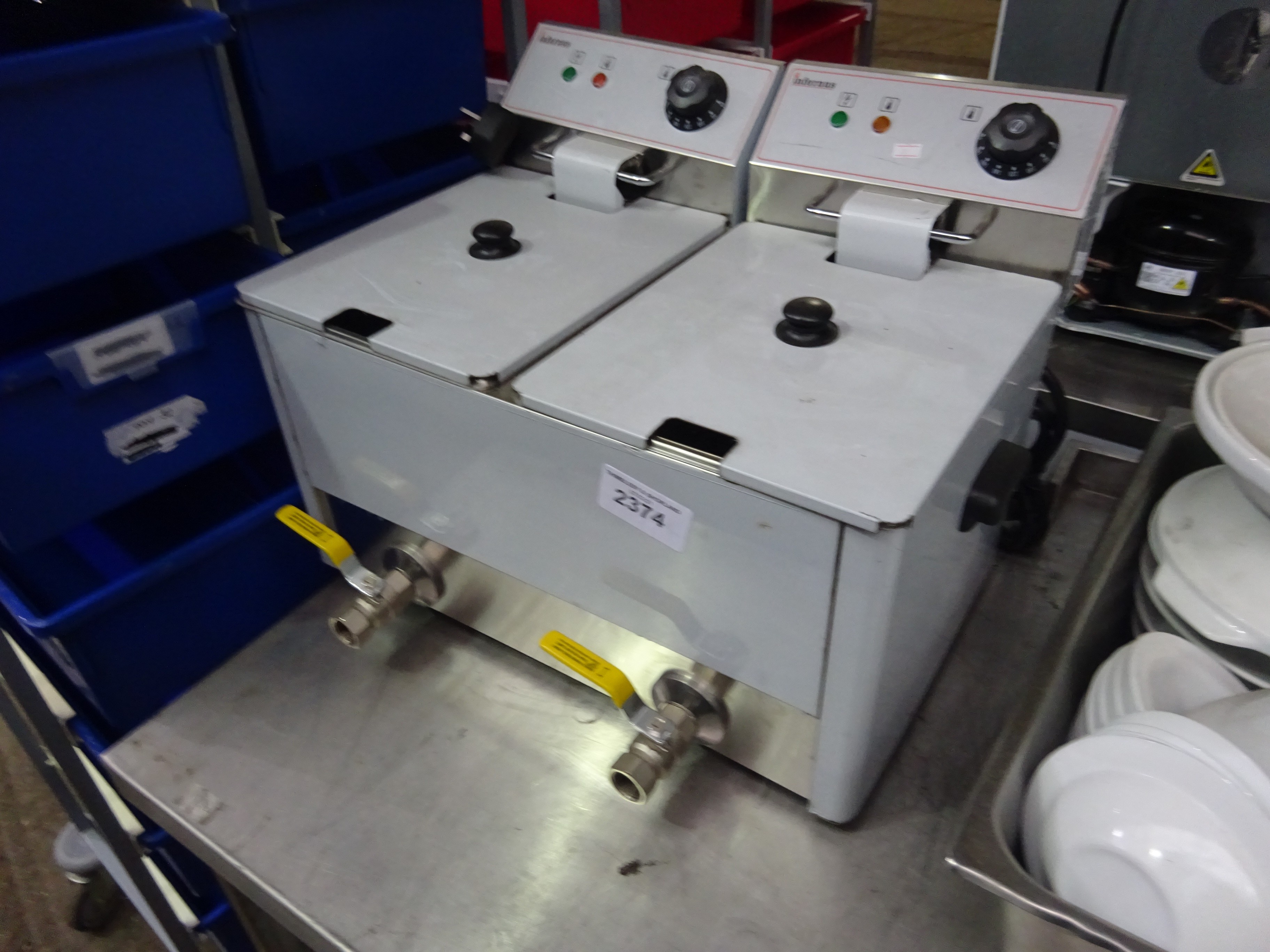 Infernus double table top fryer with front drain.