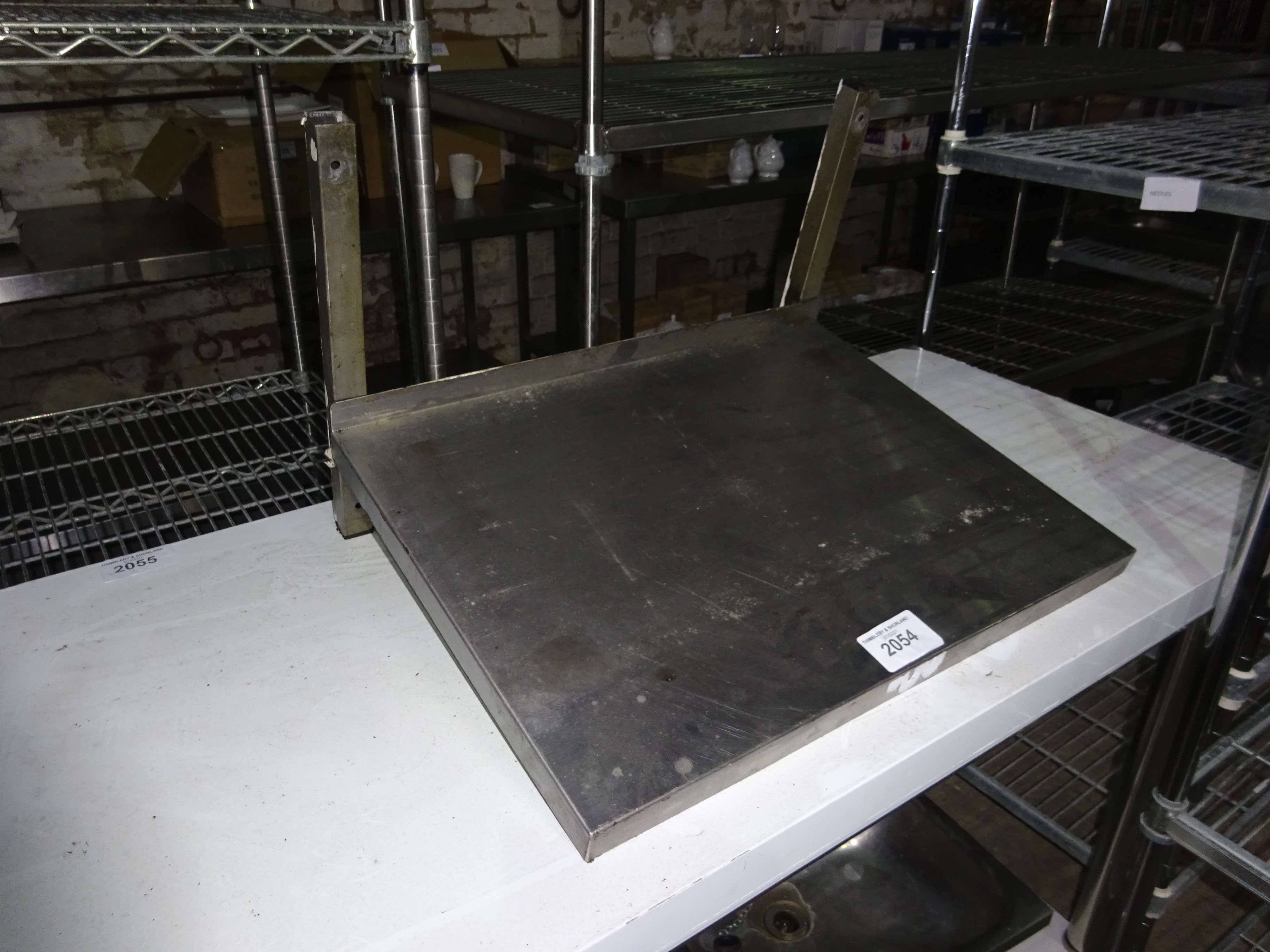 Stainless steel microwave shelf, width 60cms, depth 45cms.