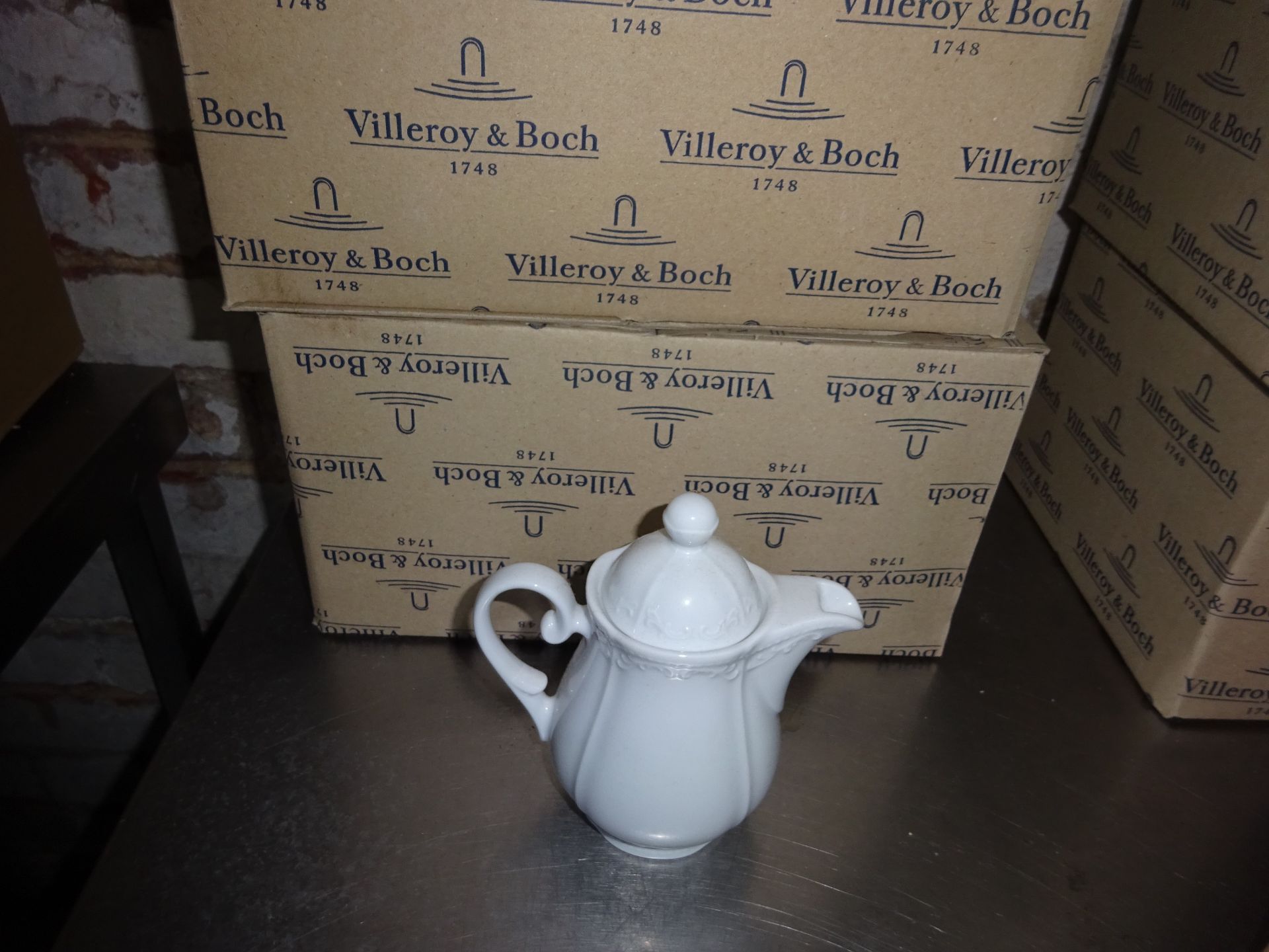 Eight Villeroy & Boch china teapots.