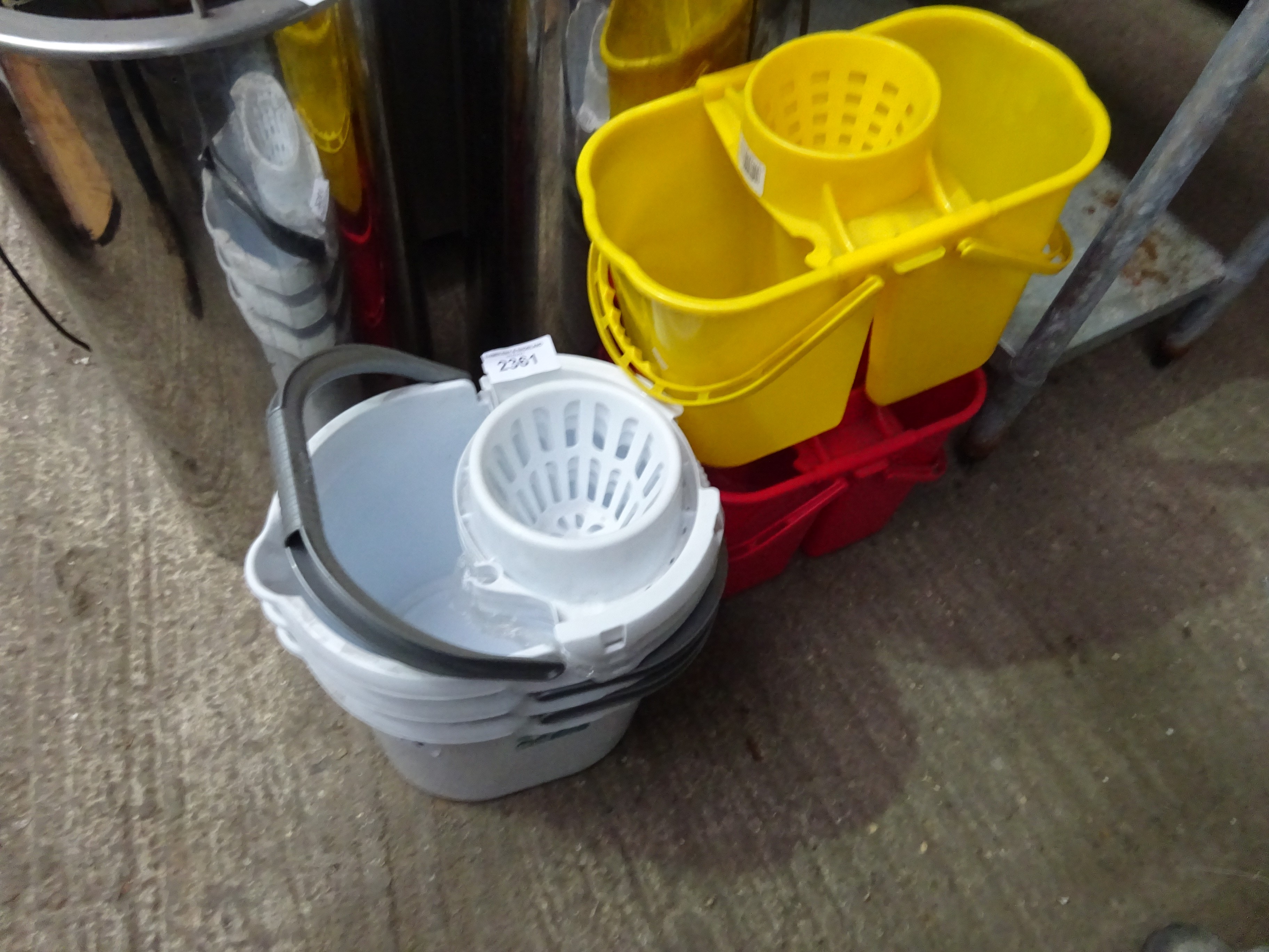 Three mop buckets.