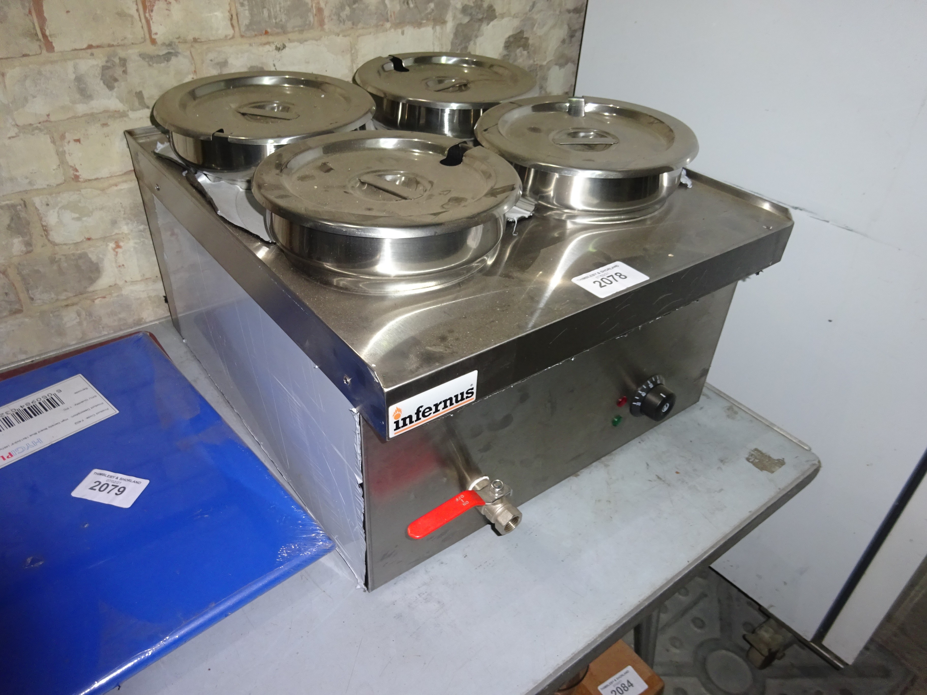 Infernus WBS520 four pot wet bain marie with drain valve to front.