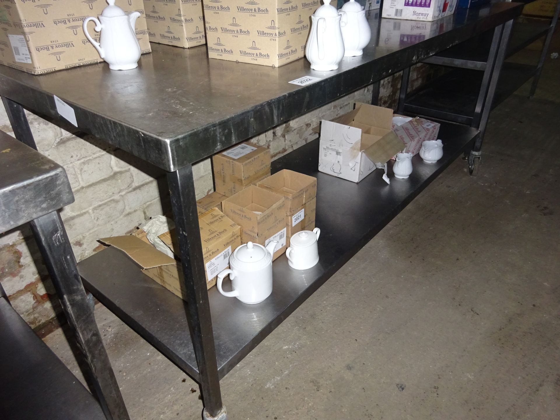 Mobile stainless steel preparation table with under shelf.