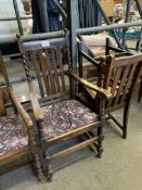 Five oak framed rail back dining chairs, a matching carver, and another carver.