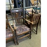 Five oak framed rail back dining chairs, a matching carver, and another carver.