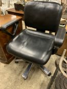 Black leather effect swivel armchair