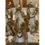 Four gilt metal three branch wall lights