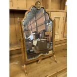 Walnut framed toilet mirror with decorative scalloped pediment