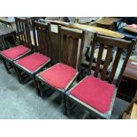 Four oak framed rail backed dining chairs