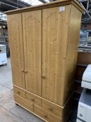 Pine triple wardrobe. This item carries VAT.