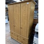 Pine triple wardrobe. This item carries VAT.