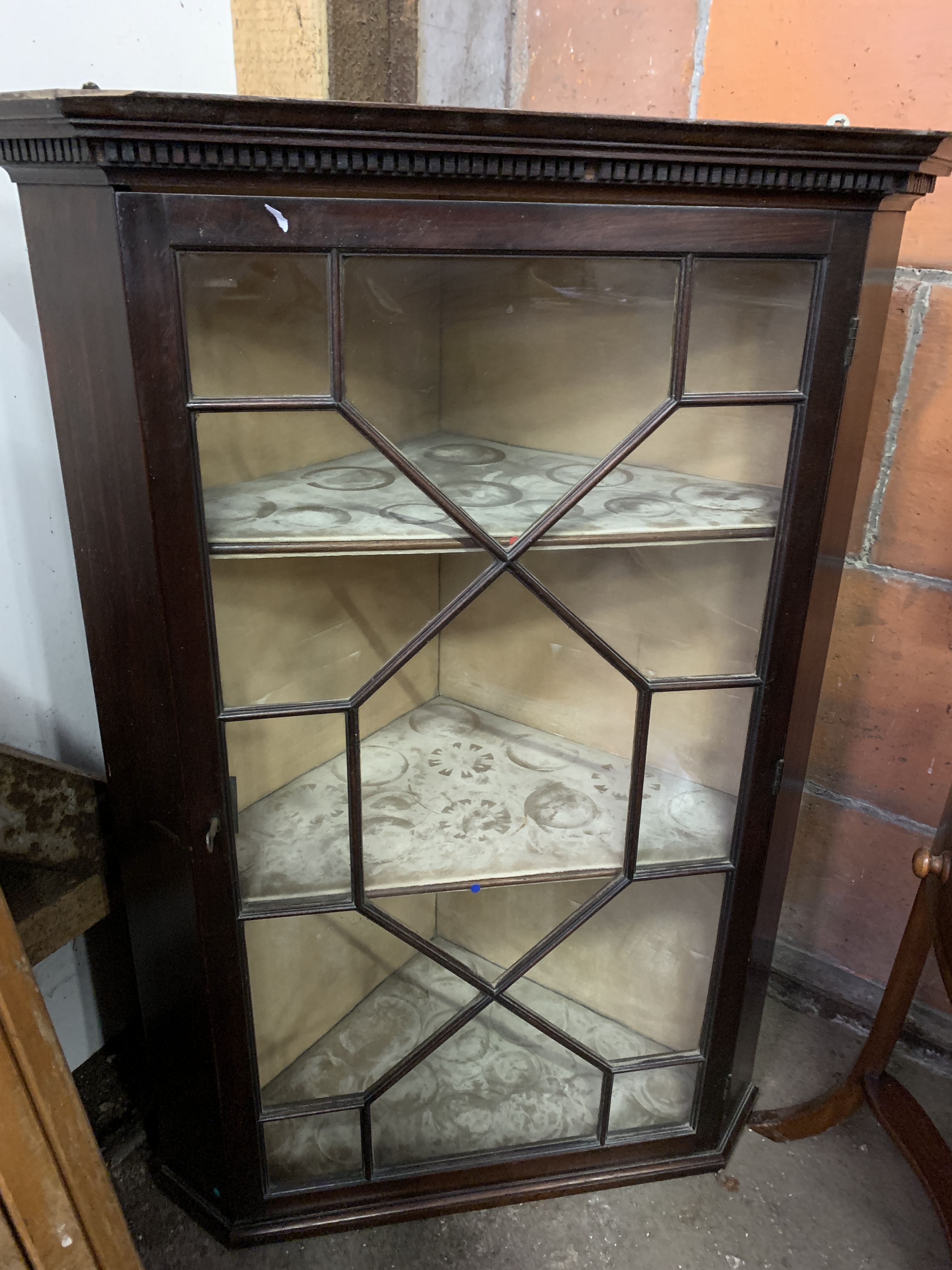 Mahogany wall-hanging corner cabinet with three shelves and glazed door with glazing bars