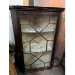 Mahogany wall-hanging corner cabinet with three shelves and glazed door with glazing bars