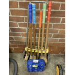 Portable croquet set and a set of boules balls