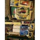 Two boxes of diecast models together with a Franklin mint Volkswagen car.