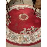 Circular red ground Chinese pattern rug.