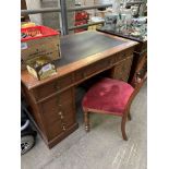 Oak pedestal desk and a mahogany framed chair