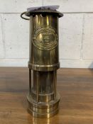 Brass paraffin safety lamp with plaque marked E Thomas & Williams Ltd