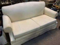 Cream upholstered two seat sofa