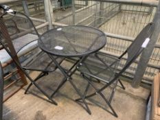 Grey metal mesh circular table, with two folding chairs