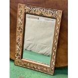 Bevelled edge mirror with ornate wood and bone inlaid frame