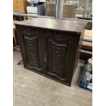 Hardwood cabinet with carved panels to doors