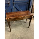 Mahogany serpentine fronted, fold over top, gate leg tea table, on tapered legs. This item carries