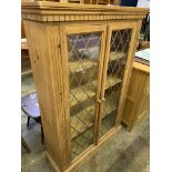 Pine shelf unit with glazed doors