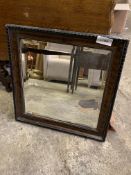 Carved decorative wood framed mirror with double bevelled edge glass