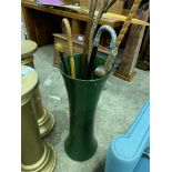 Tall ceramic vase with eight walking sticks
