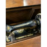 Singer B1461422 treadle operated sewing machine in mahogany cabinet