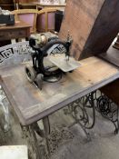 Willcox and Gibbs 'Automatic' Treadle sewing machine on a wooden stand. This item carries VAT.