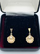 9ct gold shell-shaped pearl earrings.