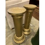 Pair of gold coloured plant stands and a wooden easel with carved pediment