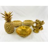 Pair of brass shell shaped dishes; gold coloured ceramic dish; gold 'pineapple' and other.