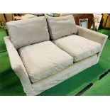 Two seat "Otto" sofa upholstered in mink smart velvet (100% polyester) by Sofa.com