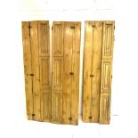 Three pairs of triple folding pine window shutters