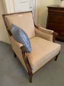 Two French style oatmeal upholstered armchairs