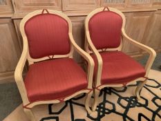 Two cream painted French style open arm chairs