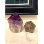 A piece of amethyst and a piece of multi-faced brown marble