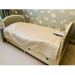 Suite of French style cream single bed; chest of three drawers; two bedside tables; and a chair