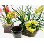 Two wood planters of lilies and orchids together with a decorative bucket.
