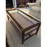 Rectangular display/coffee table with bevelled edge glass and rising lid