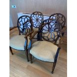 Set of four mahogany wheel back open arm chairs