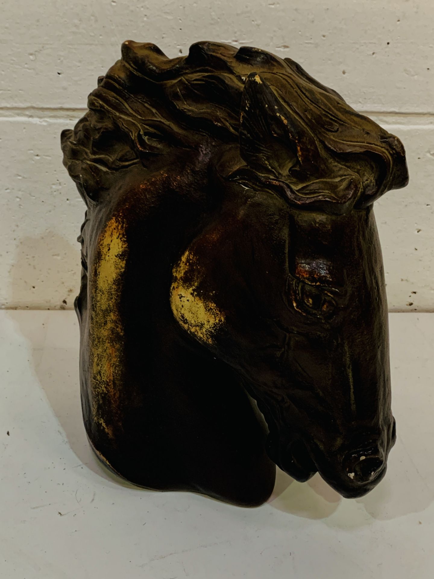 Austin plaster sculpture of horse head.