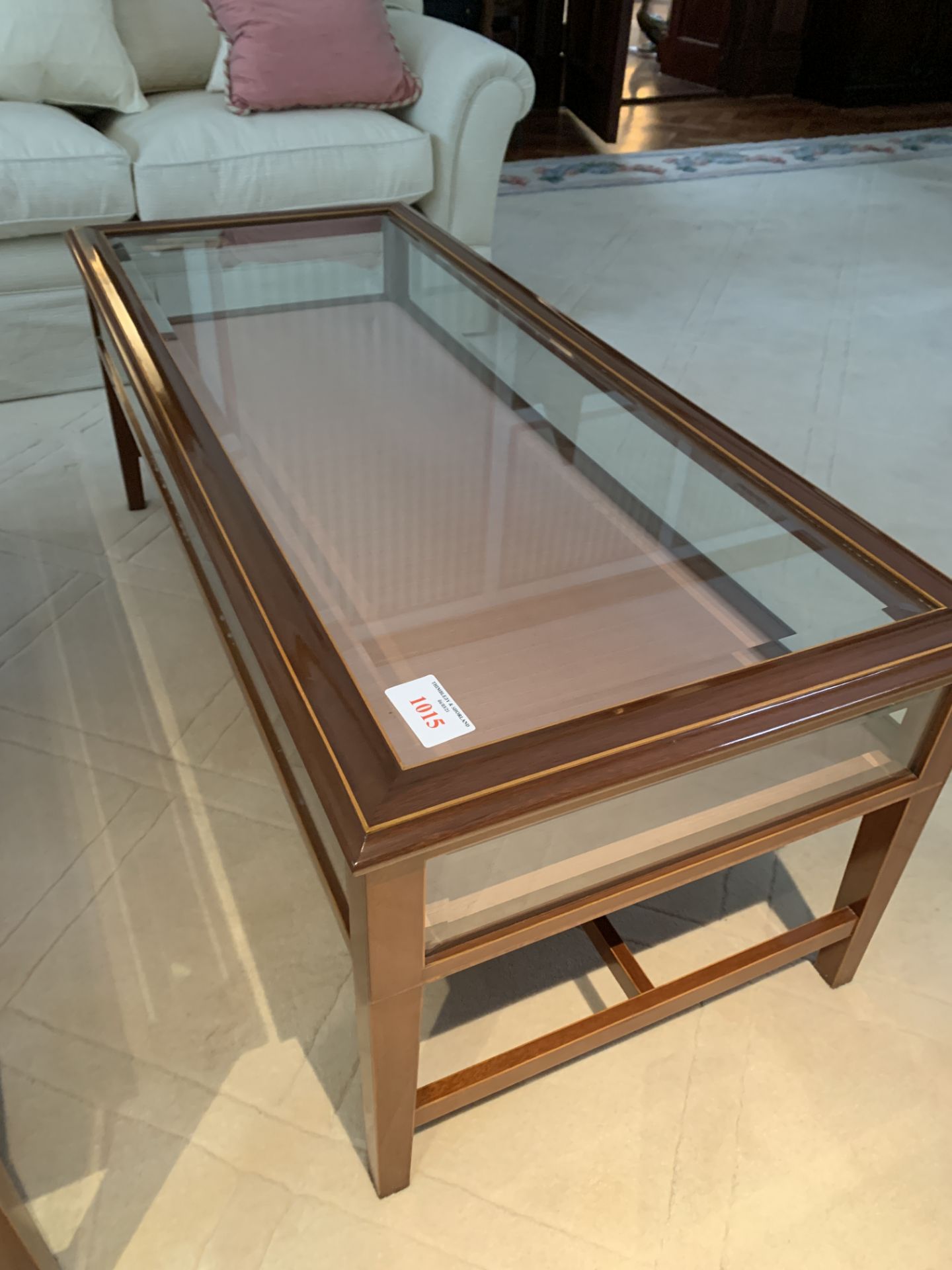 Rectangular display/coffee table with bevelled edge glass and rising lid