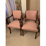 Two mahogany framed pink and cream upholstered Regency style open arm chairs