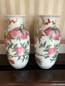 Pair of Oriental style vases decorated with flowers and fruit