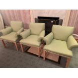 Three pistachio upholstered armchairs