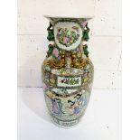 A tall famille rose oriental style vase.