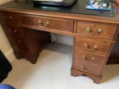 Mahogany pedestal desk together with a matching writing table